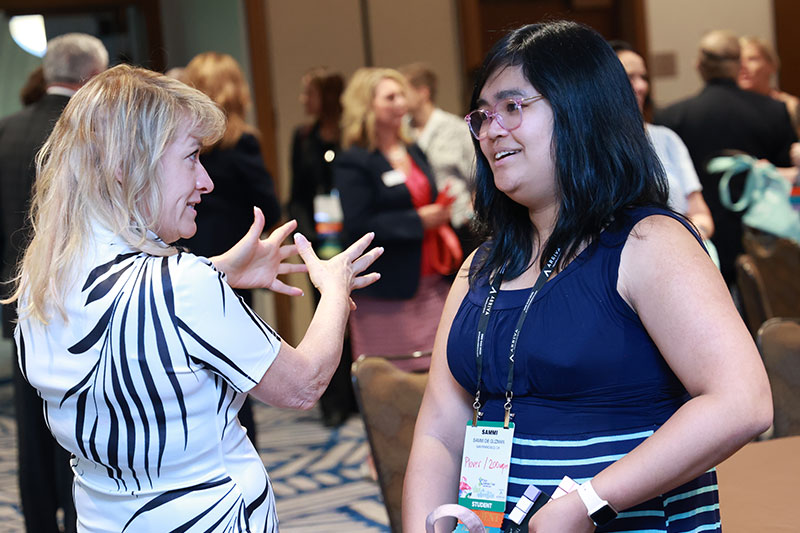 Conference attendees chatting