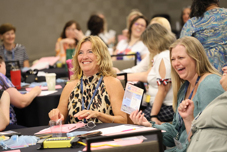 Conference attendees in session