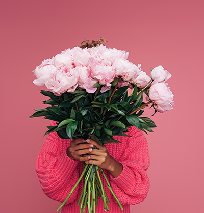 Thank you volunteers_woman holding flowers